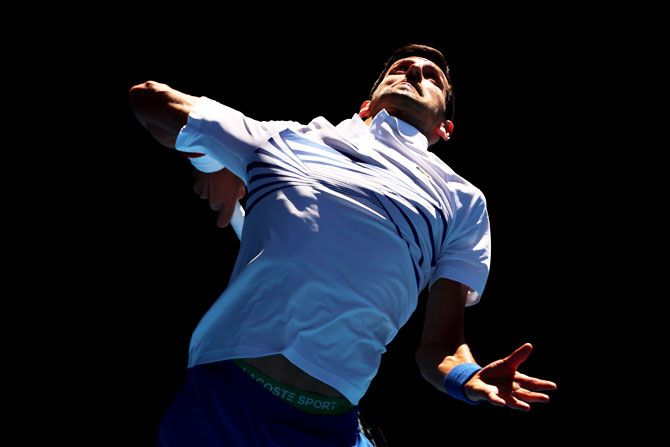 Serbia's Novak Djokovic serves in his third round match against Canada's Denis Shapovalov on Saturday