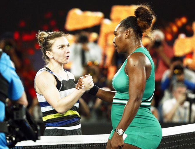 USA's Serena Williams is congratulated by Romania's Simona Halep after their fourth round match
