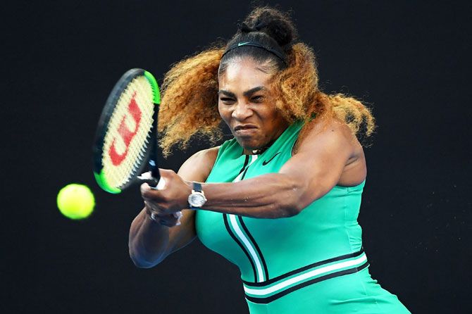 USA's Serena Williams plays a backhand in her fourth round match against Romania'S Simona Halep