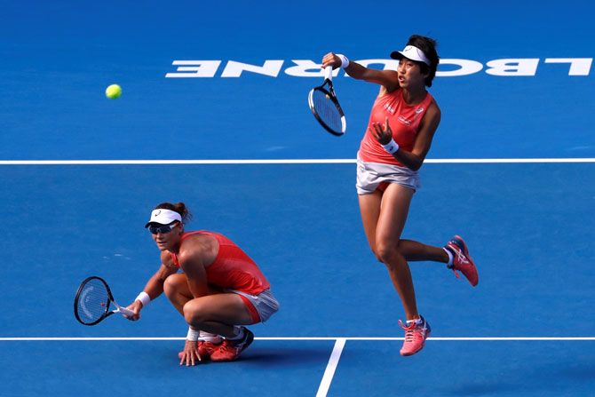 Australia's Samantha Stosur and China's Shuai Zhang in action during their match against Hungary's Timea Babos and France's Kristina Mladenovic 
