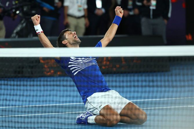 Serbia's Novak Djokovic celebrates after winning championship point to win the Australian Open in his men's singles final against Spain's Rafael Nadal on Sunday