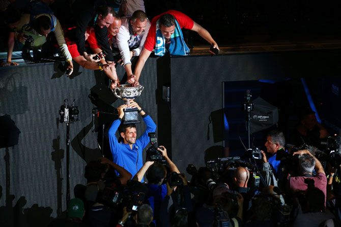 Novak Djokovic celebrates with Serbian fans following his Australian Open victory against Spain’s Rafael Nadal on Sunday