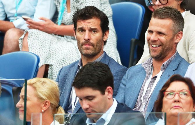 Former Australian F1 driver Mark Webber and a friend watch the men's singles final between Novak Djokovic and Rafael Nadal on Sunday