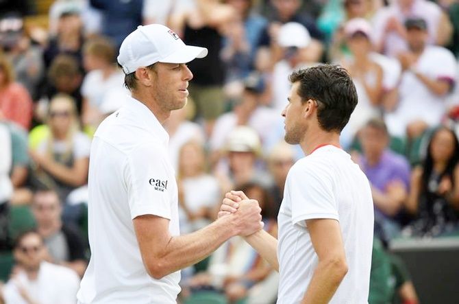 Sam Querrey and Dominic Thiem shake hands after their first round match.