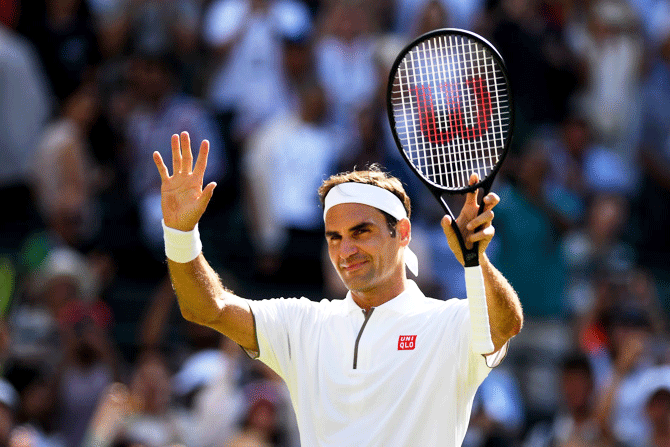 Switzerland's Roger Federer celebrates victory over Great Britain's Jay Clarke after their 2nd round match