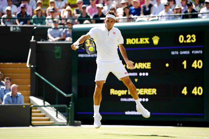 Roger Federer plays a backhand during his second round match against Jay Clarke