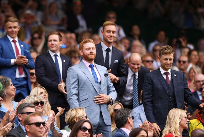 England cricketers Jonny Bairstow, Joe Root, Stuart Broad, Eoin Morgan and former captain Andrew Strauss are seen in the Royal Box on centre court at Wimbledon on Saturday