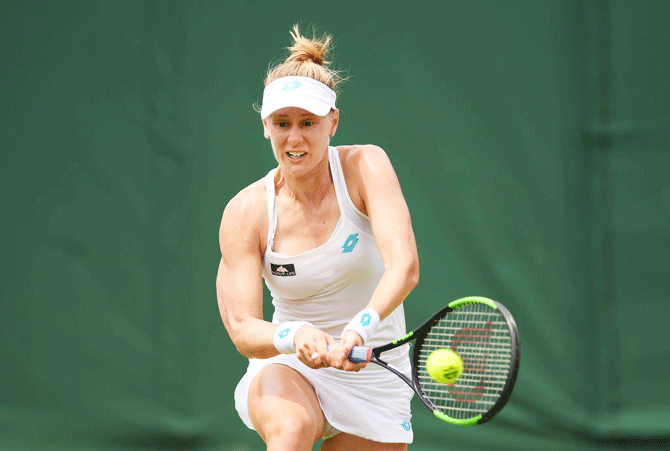 USA's Alison Riske plays a backhand in her fourth round match against Australia's Ashleigh Barty at the All England Lawn Tennis and Croquet Club in London on Monday