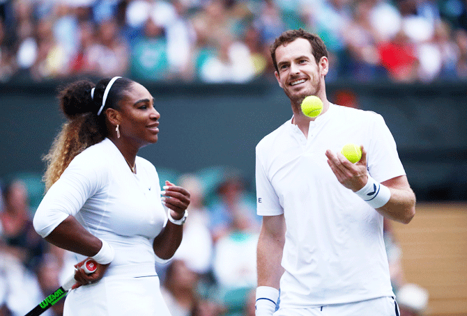 Britain's Andy Murray during with USA's Serena Williams diring their first round mixed doubles match against Chile's Alexa Guarachi and Germany's Andreas Mies on Saturday