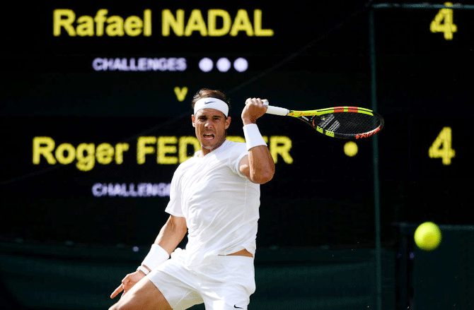 Rafael Nadal plays a forehand in the semi-final against Roger Federer at the All England Lawn Tennis and Croquet Club on in London on Friday