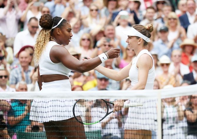 Romania's Simona Halep and Serena Williams of the United States embrace after the women's singles final at Wimbledon.