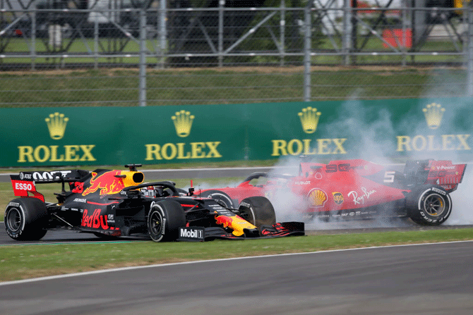 Ferrari's Sebastian Vettel crashes into Dutchman Max Verstappen's Aston Martin Red Bull Racing RB15