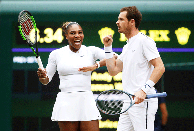 Serena Williams and Murray react during their second round mixed doubles match against France's Fabrice Martin and Raquel Atawo