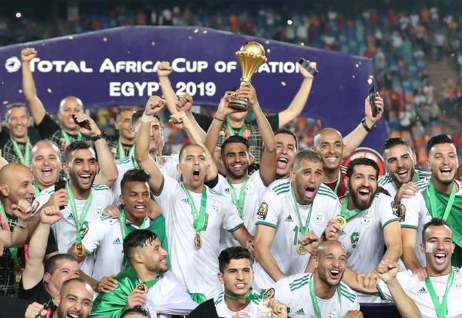  Riyad Mahrez lifts the trophy as Algeria's players celebrate winning the Africa Cup of Nations.
