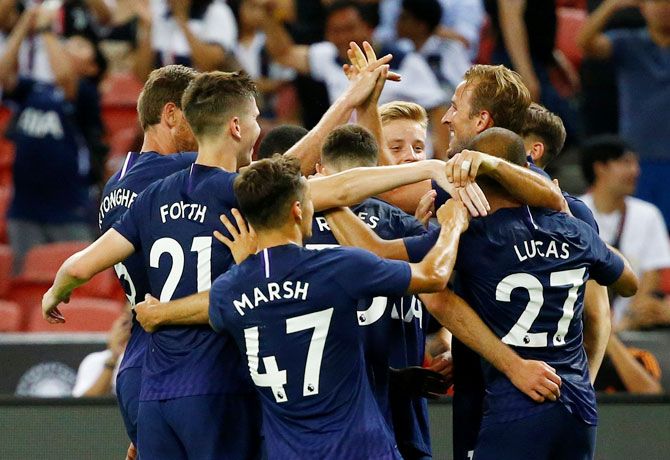 Tottenham's Harry Kane celebrates with teammates on scoring their third goal against Juventus in the International Champions Cup at Singapore National Stadium in Singapore on Sunday