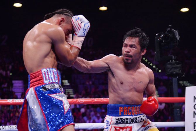 Manny Pacquiao (white trunks) and Keith Thurman exchange punches during their WBA welterweight championship bout at MGM Grand Garden Arena in Las Vegas, Nevada on Saturday. Pacquiao won via split decision