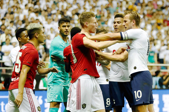 Manchester United's Scott McTominay and Tottenham Hotspur's Harry Kane square off during the International Champions Cup match