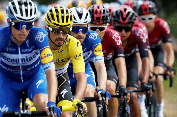 Deceuninck-Quick Step rider Julian Alaphilippe of France, wearing the overall leader's yellow jersey, in the peloton at the The 170.5-km Stage 9 from Saint-Etienne to Brioude on July 14