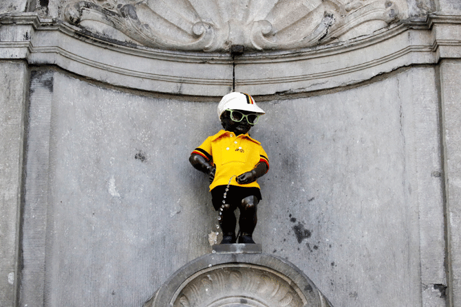 The Manneken Pis statue is dressed in the overall leader's yellow jersey, before the start of the stage 1
