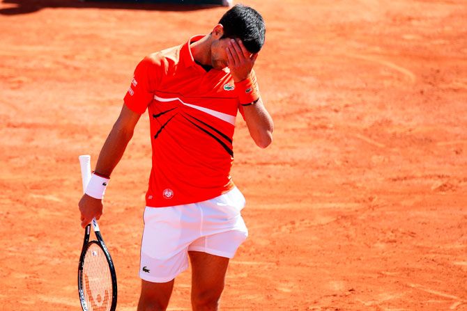 Novak Djokovic reacts during his match against Dominic Thiem