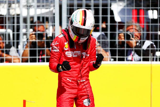 Pole position holder Sebastian Vettel of Germany and Ferrari celebrates in parc ferme after qualifying during the Canadian F1 Grand Prix at Circuit Gilles Villeneuve in Montreal, Canada, on Sunday
