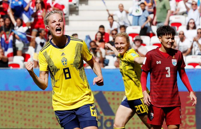 Sweden's Lina Hurtig celebrates scoring their fourth goal with Mimmi Larsson as Thailand's Natthakarn Chinwong reacts during their Women's World Cup Group F match at Stade de Nice, Nice, France on Sunday