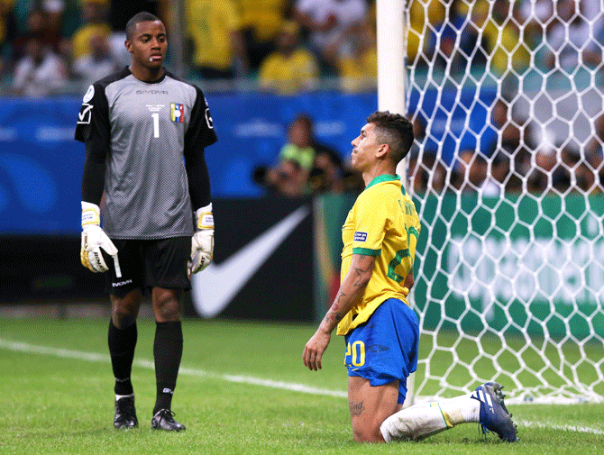 Brazil's Roberto Firmino reacts after his goal his disallowed as to Venezuela's Wuilker Farinez looks on