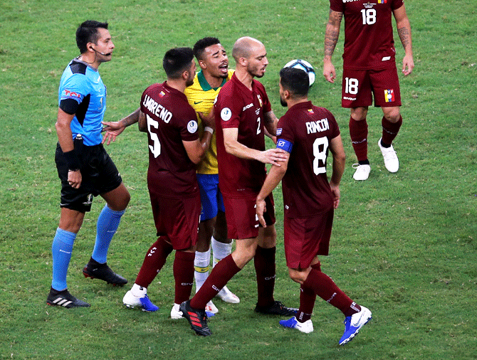 Brazil's Gabriel Jesus clashes with Venezuela's Tomas Rincon after the match