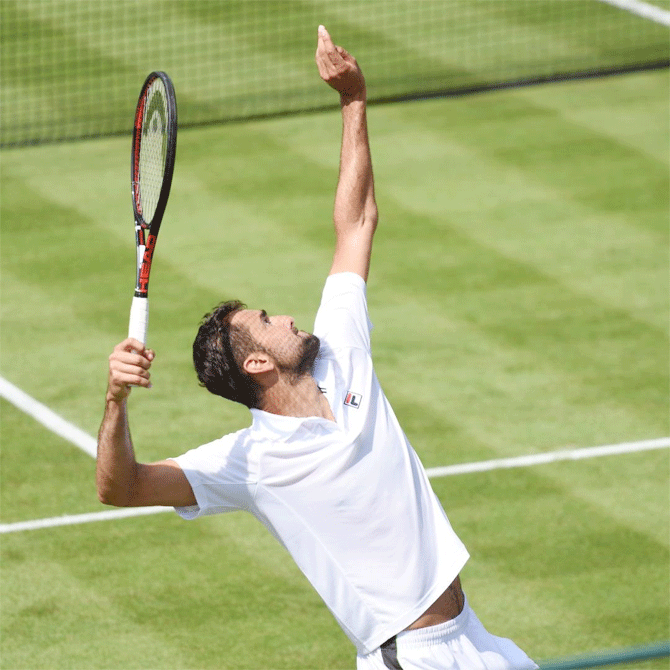 Marin Cilic serves during his match against Rafael Nadal at the Aspall Tennis Classic in London on Wednesday