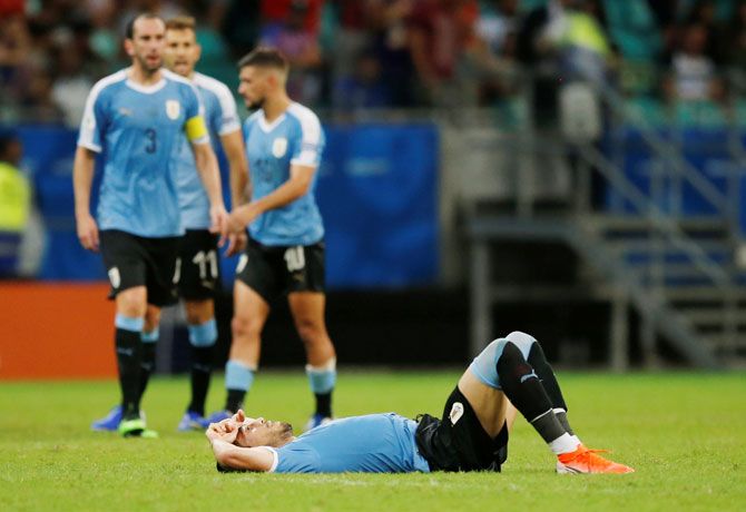 Uruguay players react at the end of their Copa America match against Peru 
