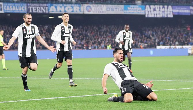 Juventus' Emre Can celebrates with teammates after scoring the team's second goal