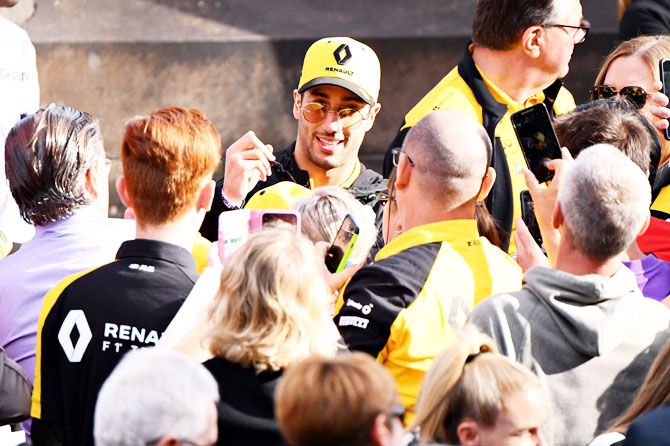 Renault's Australian driver Daniel Ricciardo signs interacts with fans at the F1 Live event on Wednesday