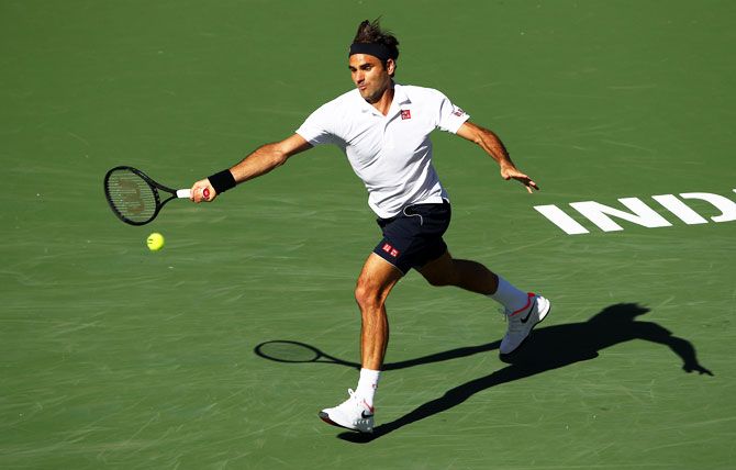 Switzerland's Roger Federer plays a forehand against Great Britain's Kyle Edmund during their men's singles fourth round match