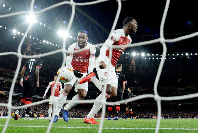 Arsenal's Ainsley Maitland-Niles celebrates after scoring their second goal against Stade Rennes during their Europa League, round of 16, second leg match on Thursday