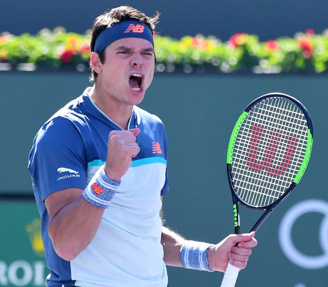 Canada's Milos Raonic celebrates match point after defeating Serbia's Miomir Kecmanovic in the quarter-final at the Indian Wells Tennis Garden