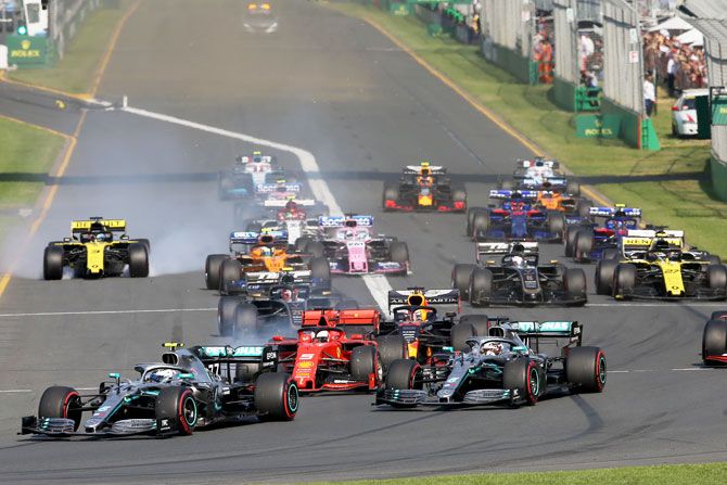 Valtteri Bottas driving the (77) Mercedes AMG Petronas F1 Team Mercedes W10 leads teammate Lewis Hamilton and the rest of the field at the start during the Australian F1 Grand Prix at Albert Park in Melbourne on Sunday