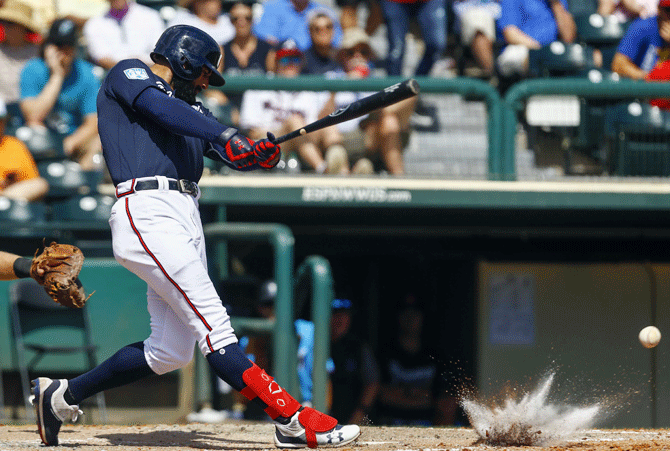 Atlanta Braves right fielder Nick Markakis (22) hits into the dirt during the sixth inning of a game against the Miami Marlins at Champion Stadium in Lake Buena Vista, Florida on Friday, March 15