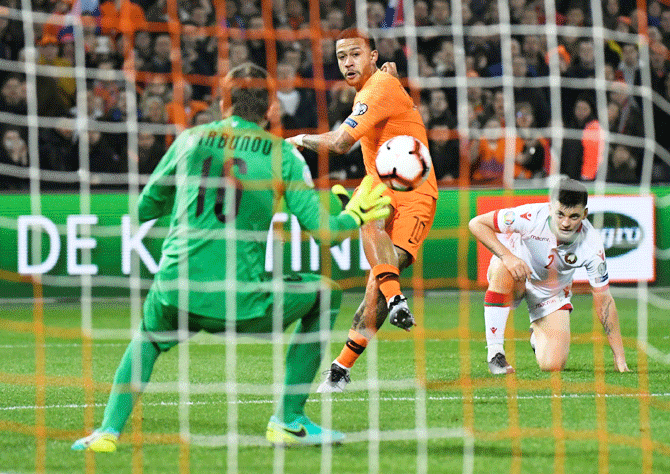Netherlands' Memphis Depay shoots to score in the Euro 2020 Qualifier Group C match against Belarus at De Kuip Stadion Feijenoord in Rotterdam