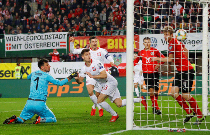 Poland's Krzysztof Piatek scores their first goal against Austria during their Euro 2020 Qualifier  Group G match at Ernst Happel Stadium in Vienna