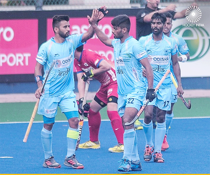 India players celebrate on scoring against Japan in the Azlan Shah Cup hockey tournament opener in Ipoh, Malaysia, on Saturday