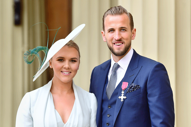 England football captain Harry Kane with his partner Kate Goodland after he was made an MBE (Member of the Order of the British Empire) by the Duke of Cambridge at an investiture ceremony at Buckingham Palace in London on Thursday