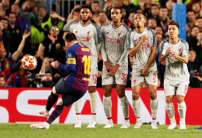 Barcelona's Lionel Messi converts a stunning free kick to net their third goal, his second of the night at Camp Nou in Barcelona