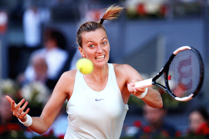 Czech Republic's Petra Kvitova returns the ball in her match against France's Kristina Mladenovic on Day 3 of the Mutua Madrid Open at La Caja Magica in Madrid on Monday
