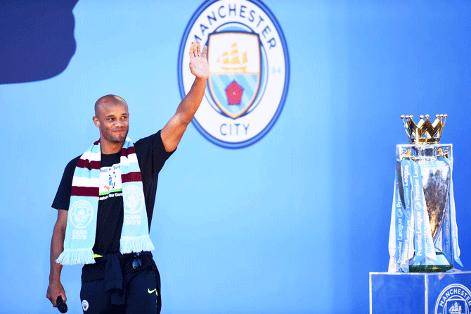 Manchester City's outgoing captain Vincent Kompany acknowledges fans during the Manchester City Teams Celebration Parade in Manchester on Monday