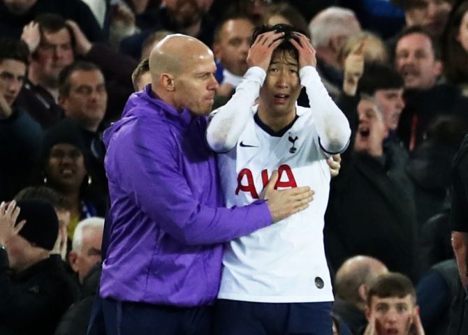 Tottenham Hotspur's Son Heung-min looks dejected after Everton's Andre Gomes sustains an injury after tackling him during their English Premier League match at Goodison Park in Liverpool on Sunday 