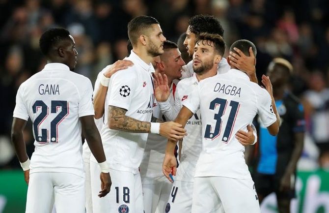 Mauro Icardi celebrates with his Paris St Germain's teammates after scoring  in the Group A match against Club Brugge