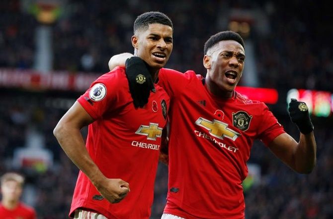 Marcus Rashford celebrates scoring Manchester United's third goal with Anthony Martial during Sunday's Premier League match against Brighton & Hove Albion