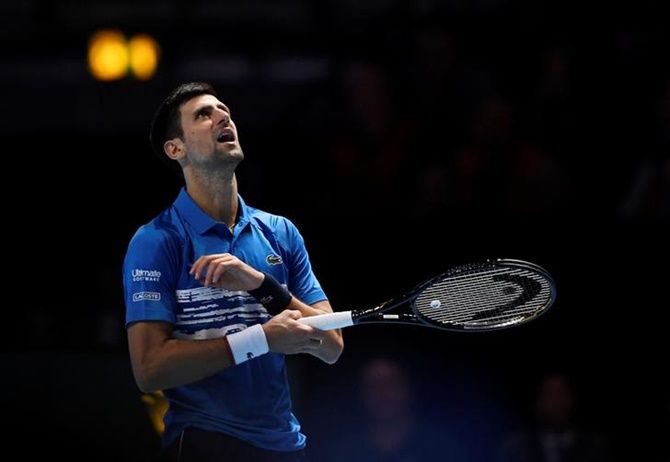 Novak Djokovic reacts after committing an unforced error.