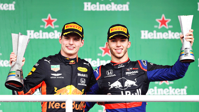 Race winner Max Verstappen of Red Bull Racing and second placed Pierre Gasly of Scuderia Toro Rosso celebrate on the podium after the Brazil F1 GP at Autodromo Jose Carlos Pace at Interlagos in Sao Paulo, Brazil on Sunday 