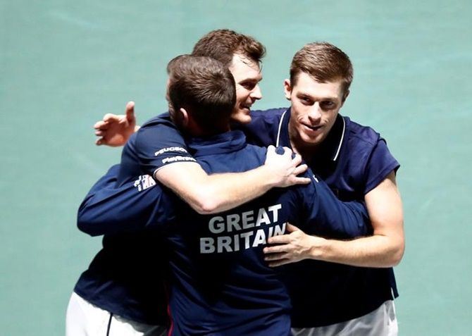 Britain's Jamie Murray and Neal Skupski celebrate with captain Leon Smith after winning their doubles match against Kazakhstan's Alexander Bublik and Mikhail Kukushkin.